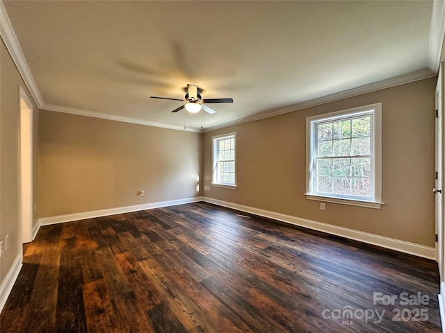 spare room featuring ceiling fan, ornamental molding, and dark wood-type flooring