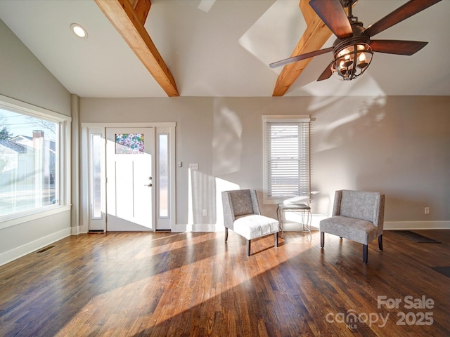 sitting room with vaulted ceiling with beams, ceiling fan, and dark hardwood / wood-style flooring