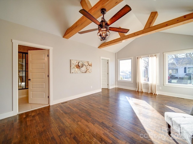 unfurnished living room featuring ceiling fan, lofted ceiling with beams, and dark hardwood / wood-style flooring