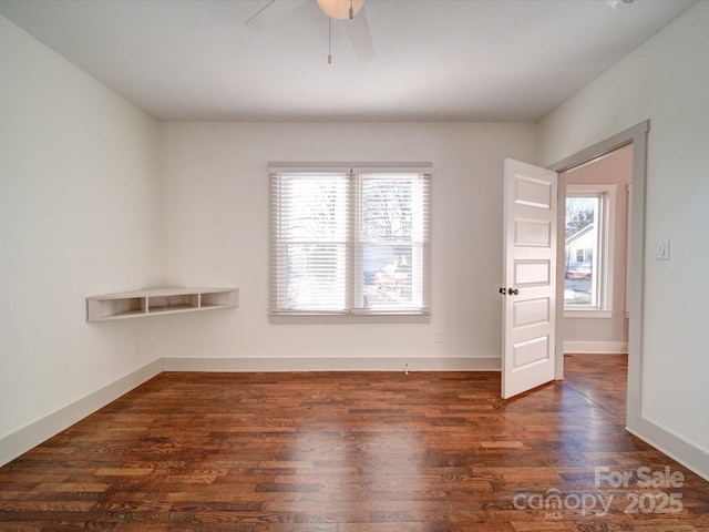 unfurnished room with ceiling fan and dark hardwood / wood-style flooring