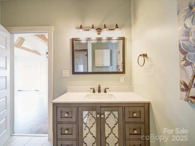 bathroom with tile patterned floors and vanity