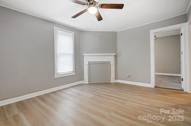 unfurnished living room featuring ceiling fan and light wood-type flooring