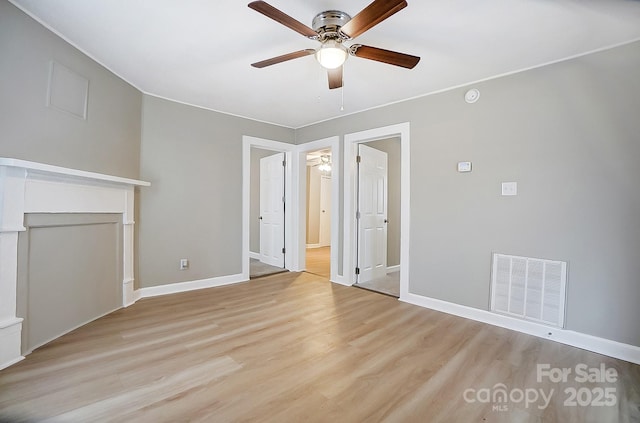 unfurnished living room featuring light wood-type flooring and ceiling fan