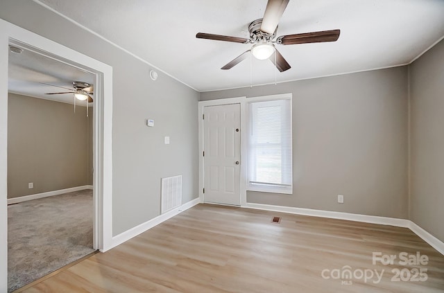 entrance foyer with light hardwood / wood-style flooring and ceiling fan