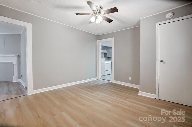 unfurnished bedroom with ceiling fan, light hardwood / wood-style floors, and a textured ceiling