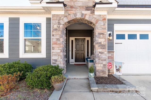 entrance to property featuring a garage