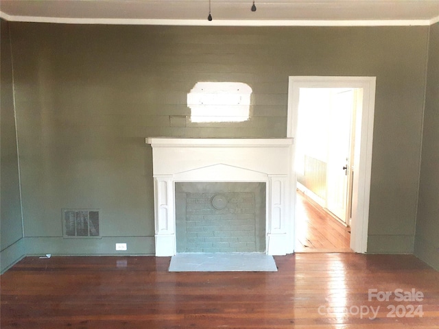 unfurnished living room with dark wood-type flooring