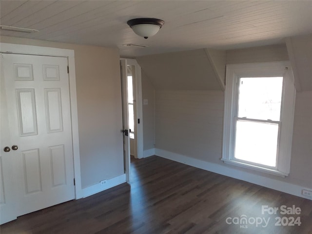 bonus room with dark hardwood / wood-style flooring, plenty of natural light, and wooden ceiling