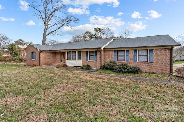 single story home featuring a front yard