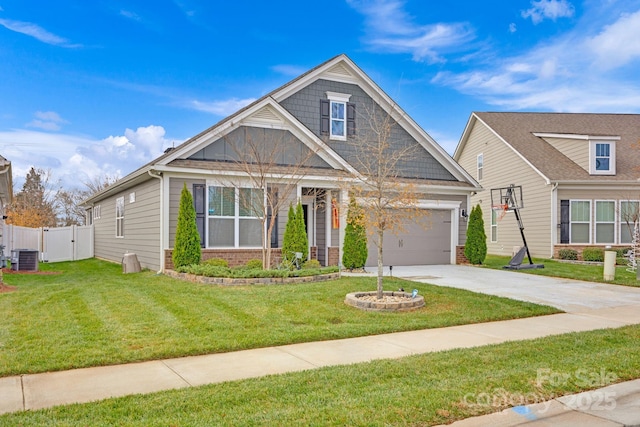 view of front of property with a front yard, a garage, and cooling unit