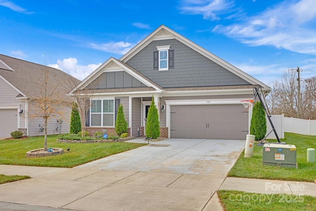 craftsman-style home with a front yard and a garage