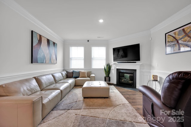 living room featuring hardwood / wood-style floors and ornamental molding