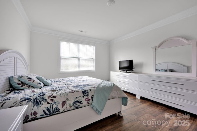 bedroom featuring ornamental molding and dark wood-type flooring