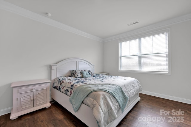 bedroom featuring ornamental molding and dark wood-type flooring