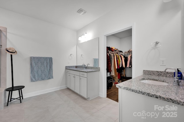 bathroom featuring tile patterned floors and vanity