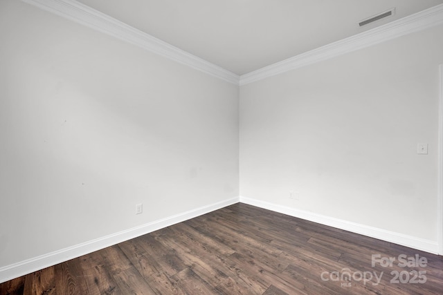 unfurnished room featuring dark hardwood / wood-style flooring and ornamental molding