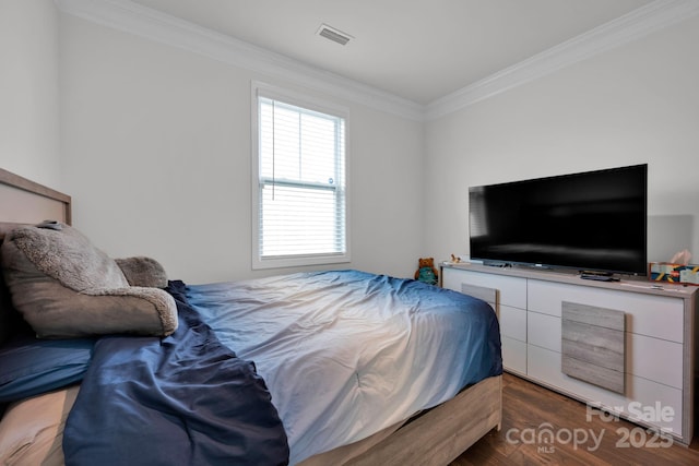 bedroom featuring crown molding