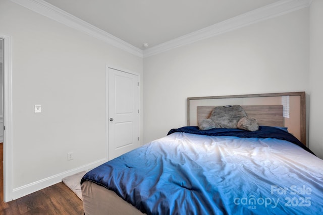 bedroom featuring dark hardwood / wood-style floors and ornamental molding