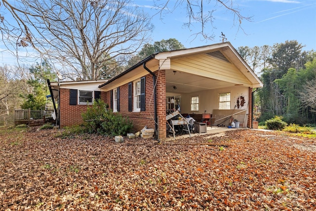 view of side of home with a patio