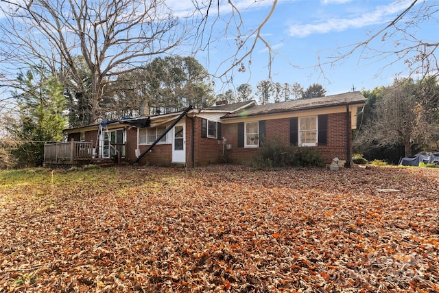 view of front of home with a wooden deck