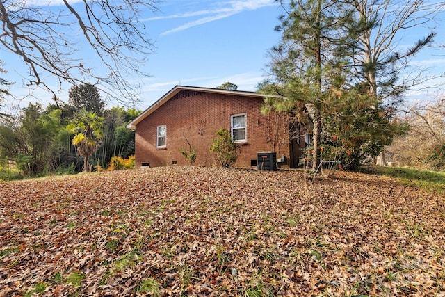 view of side of home with cooling unit