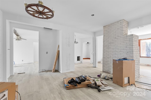 interior space with hardwood / wood-style floors and ceiling fan