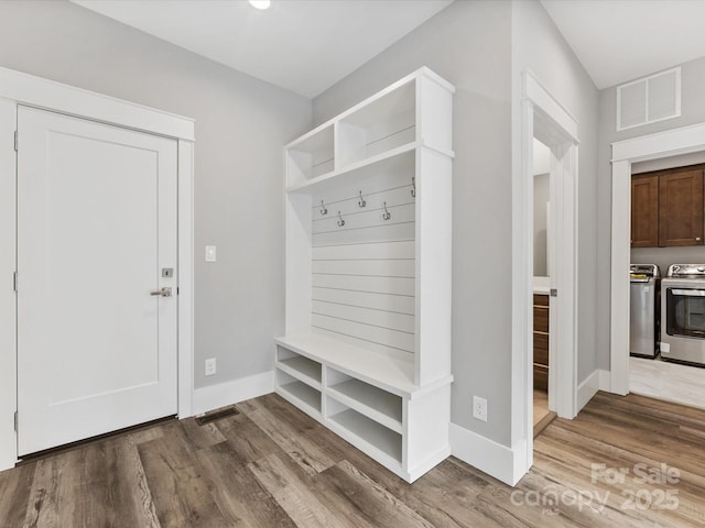 mudroom featuring washer and clothes dryer and hardwood / wood-style flooring