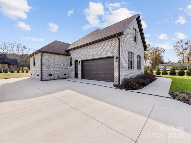 view of side of property with a garage