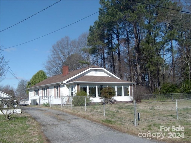 view of front of home featuring cooling unit