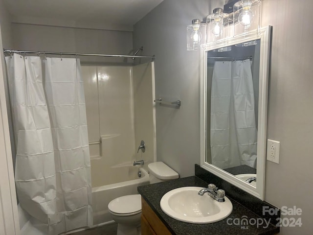 full bathroom with shower / tub combo with curtain, vanity, and toilet