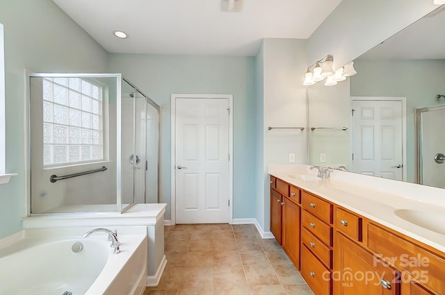 bathroom featuring tile patterned floors, vanity, and independent shower and bath