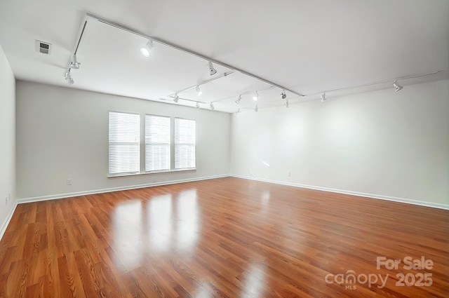 unfurnished room featuring wood-type flooring