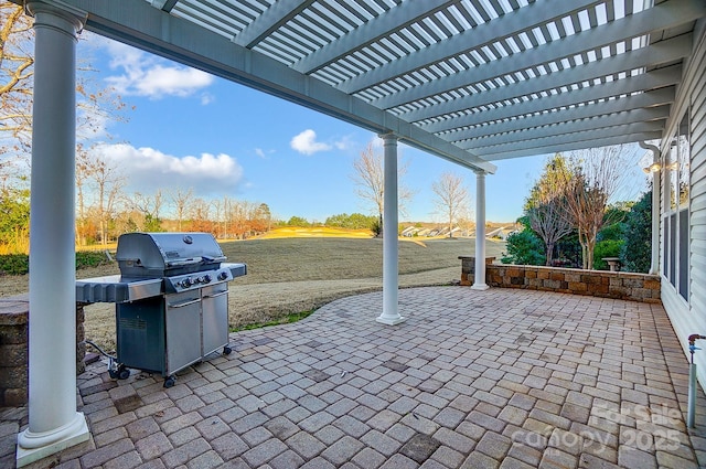 view of patio / terrace with a pergola and a grill