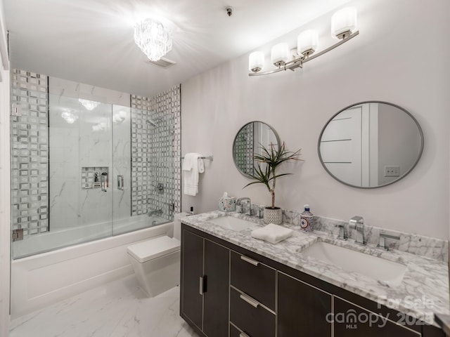 bathroom featuring shower / bath combination with glass door and vanity