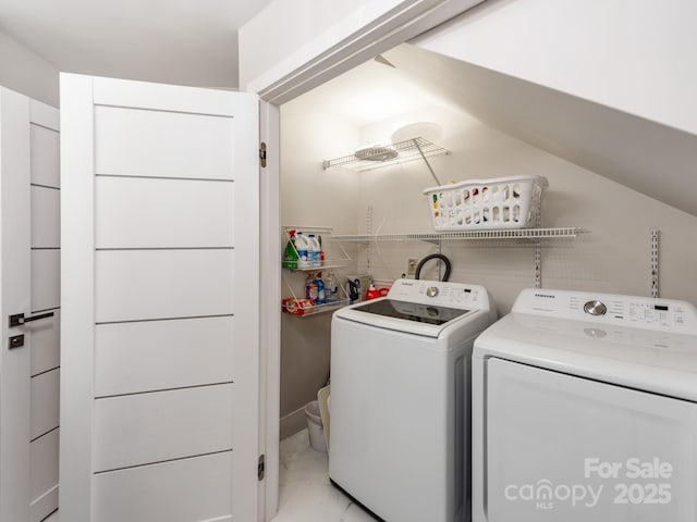 clothes washing area with separate washer and dryer