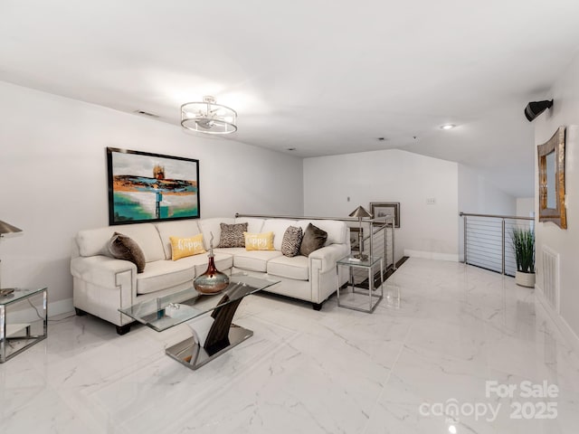 living room featuring an inviting chandelier and lofted ceiling