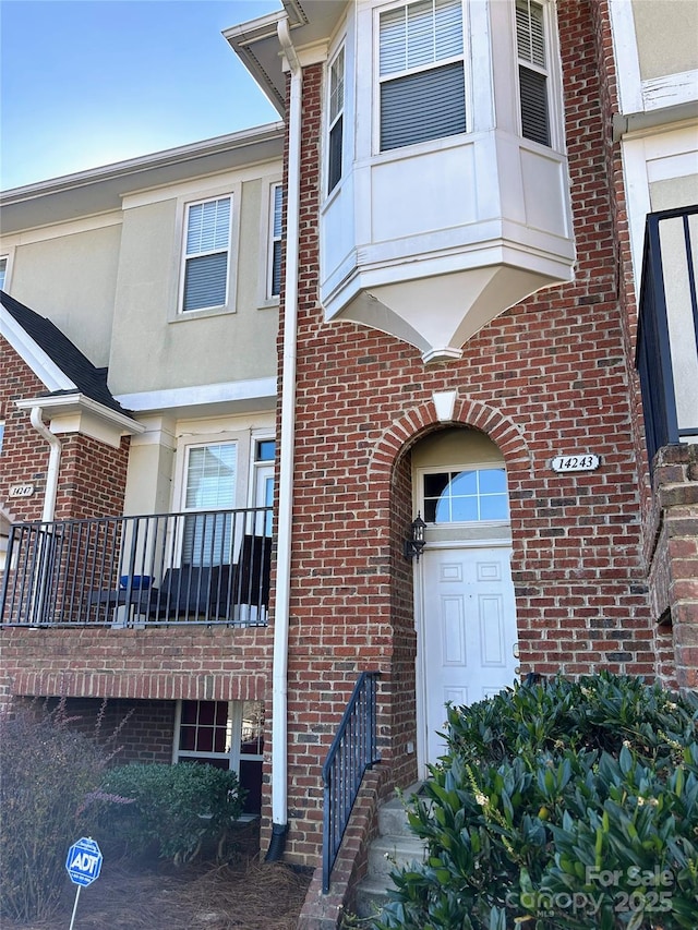 property entrance with a balcony