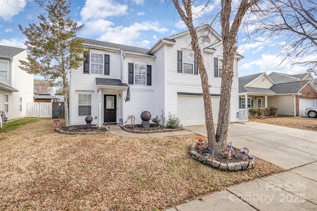 view of front property with a garage and a front lawn