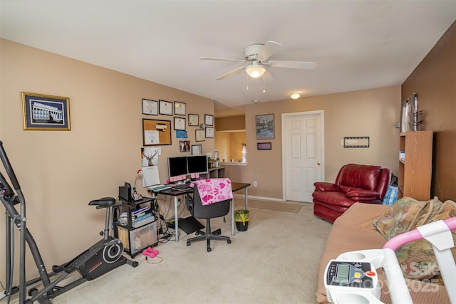 carpeted office space with ceiling fan