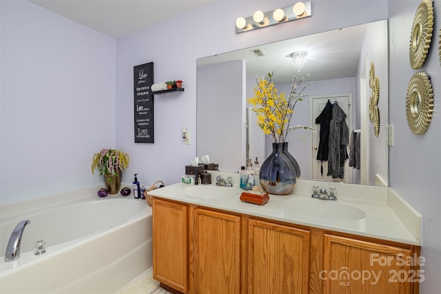 bathroom with a bathing tub and vanity