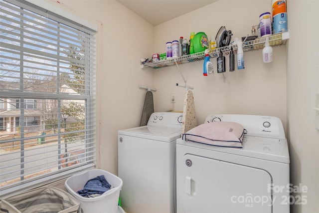 washroom featuring washer and clothes dryer