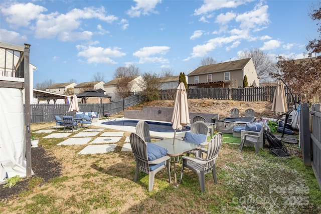 view of yard featuring a patio and a covered pool