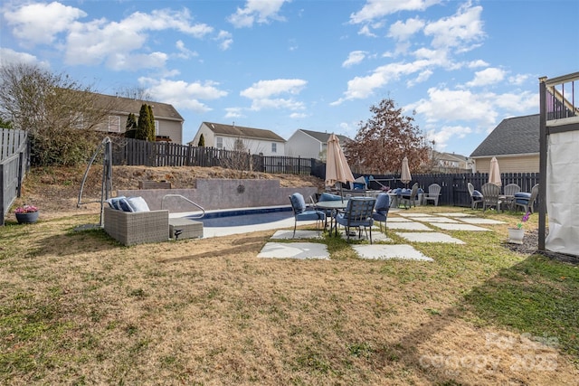 view of yard featuring an empty pool and a patio area