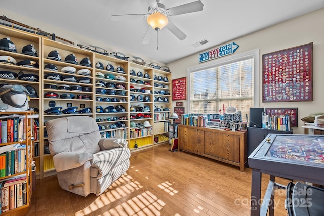 interior space with ceiling fan and hardwood / wood-style flooring