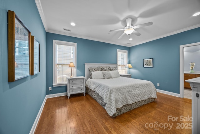 bedroom featuring hardwood / wood-style flooring, ceiling fan, and crown molding