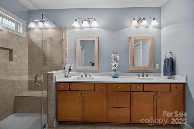 bathroom with an enclosed shower and vanity