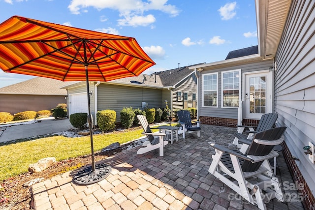 view of patio / terrace with a garage