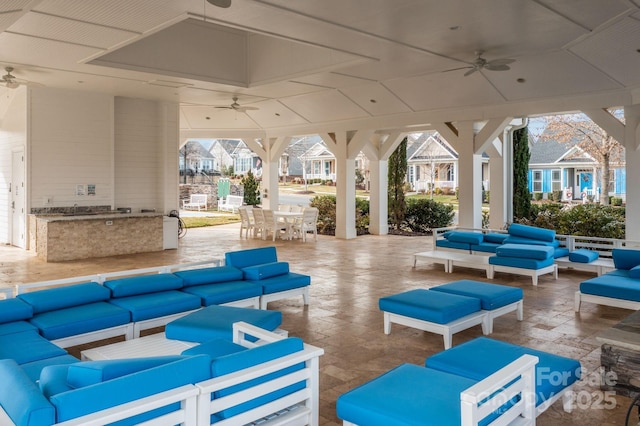 exterior space with ceiling fan and outdoor lounge area