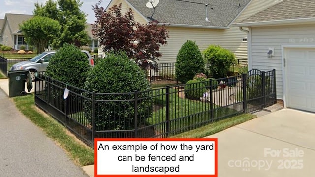 view of side of property with a shingled roof and fence