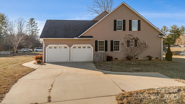 front of property featuring a front yard and a garage